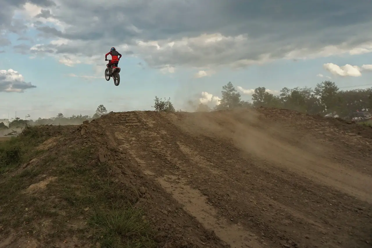 Rider launching off the back hill at McLarty MX Park